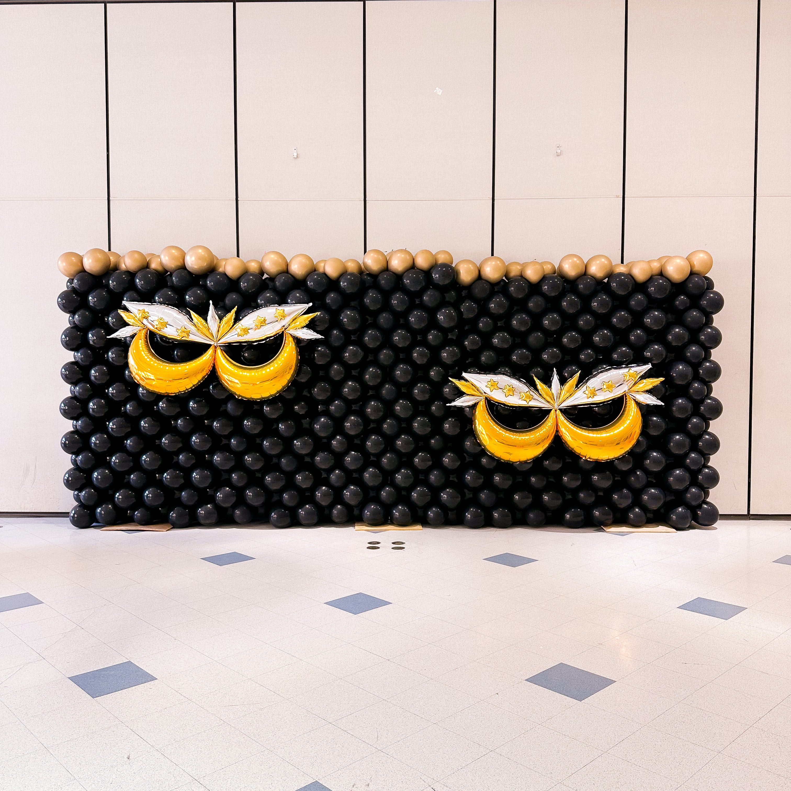 masquerade theme balloon wall at Connecticut College in CT