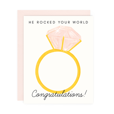 He Rocked Your World Engagement Greeting Card, a white card with the image of an engagement ring with the words 'he rocked your world, Congratulations!'