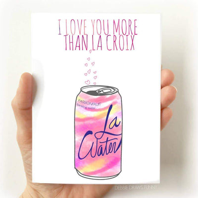 A white birthday card with an image of a La Croix passionfruit sparkling water with the words 'I love you more than La Croix' printed above