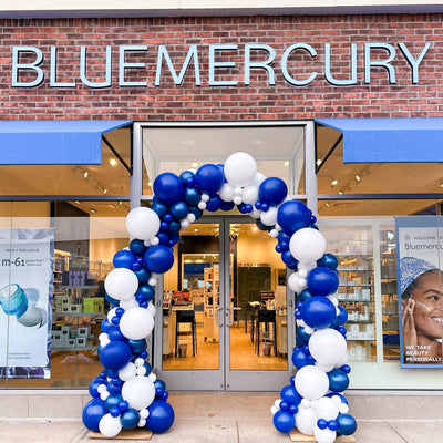 Blue and white balloon arch for grand opening in south windsor ct 