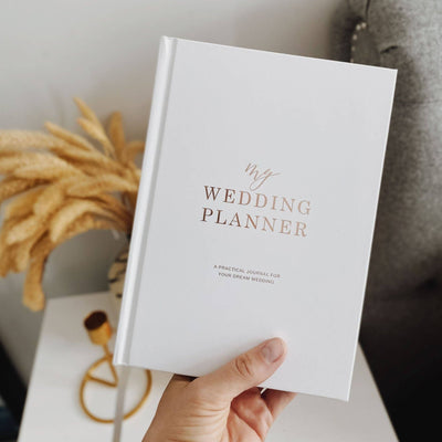 white and rose gold wedding planner 