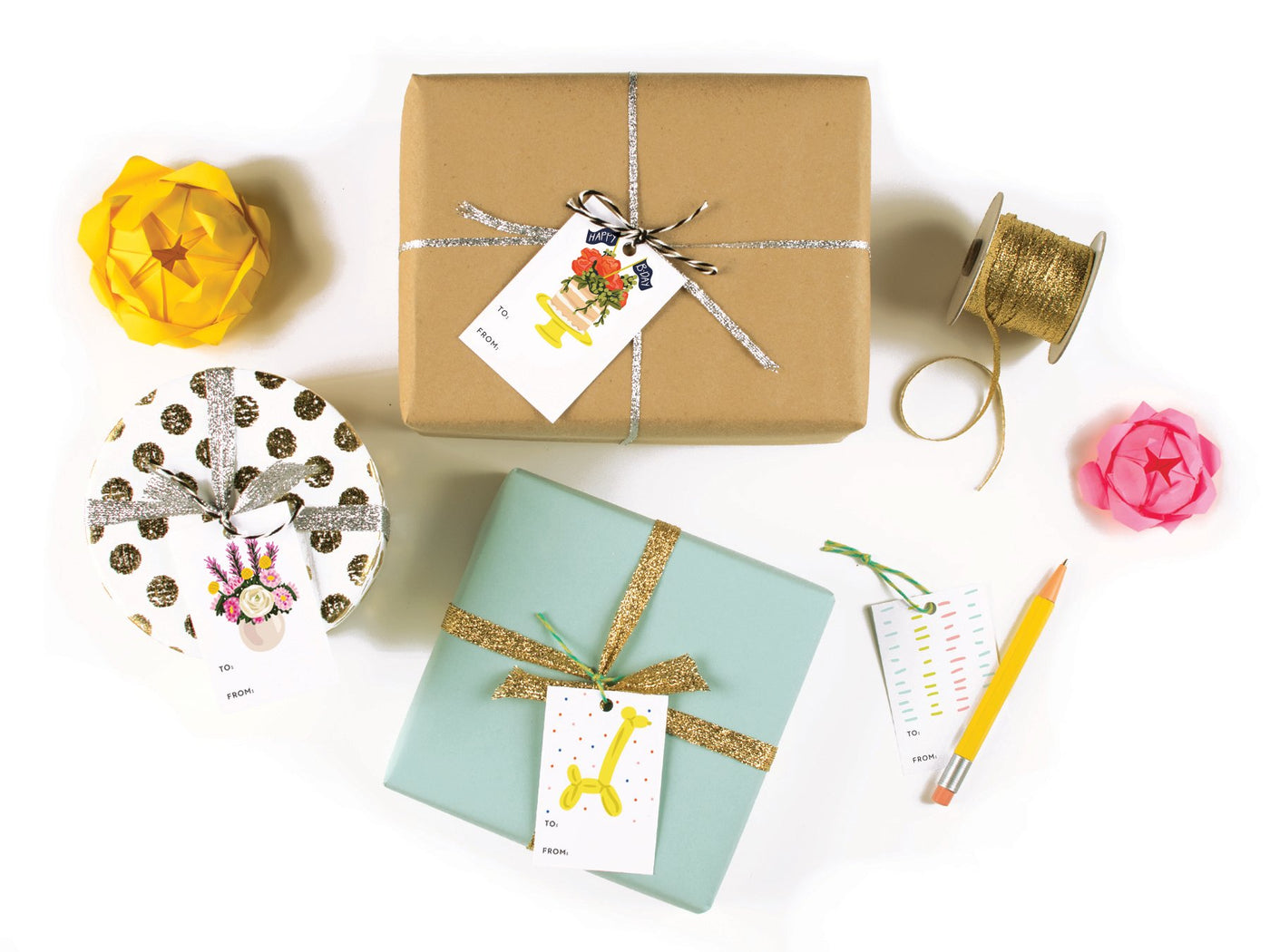 View of gift tags including a balloon giraffe gift tag attached to a gift using twine