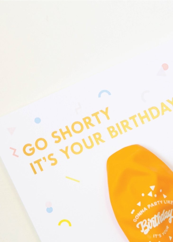Signature birthday balloon card on white card stock reading 'go shorty it's your birthday' with gold colored balloon