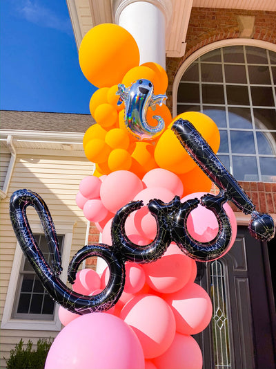 Spooky black spiderweb balloon spelling the word boo!