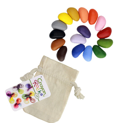 Crayon Rocks in all the colors of the rainbow with a beige muslin storage bag