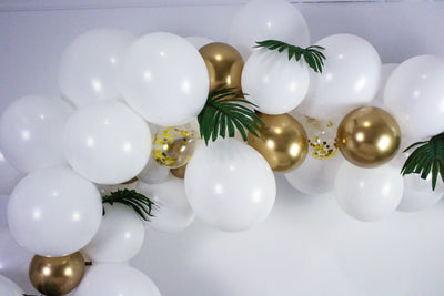 DIY Balloon Garland in white and gold including an assortment of balloons in white, gold, and clear with gold confetti 5 feet in length when assembled.