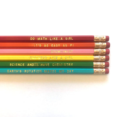 Pencils in the ‘Girls in STEM’ pack are assorted colors and read: “do math like a girl” / “it’s as easy as pi” / “stem-inist” / “engineer like a girl” / “science and I have chemistry” / “earth’s rotation makes my day”