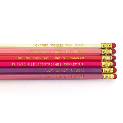 An assortment of 6 #2 Hex pencils in different colors with cheeky grammar sayings imprinted in gold 