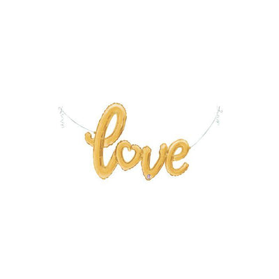 A gold Mylar foil balloon spelling the word 'love'