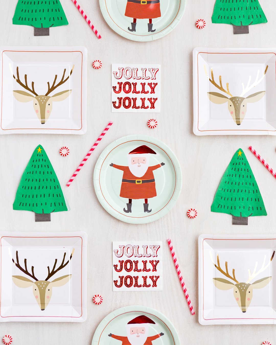 Jolly holiday napkins set amongst other party supplies such as Santa and reindeer plates