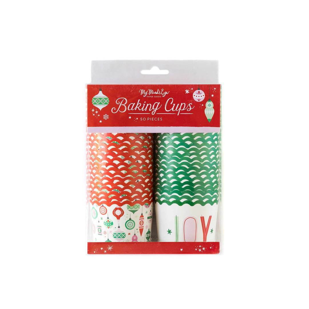 A package of baking cups in holiday themes and colors with the word 'Joy' imprinted on them and images of Christmas ornaments 