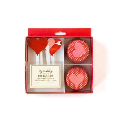 A Valentine's Day themed cupcake kit containing baking cups and heart decorations